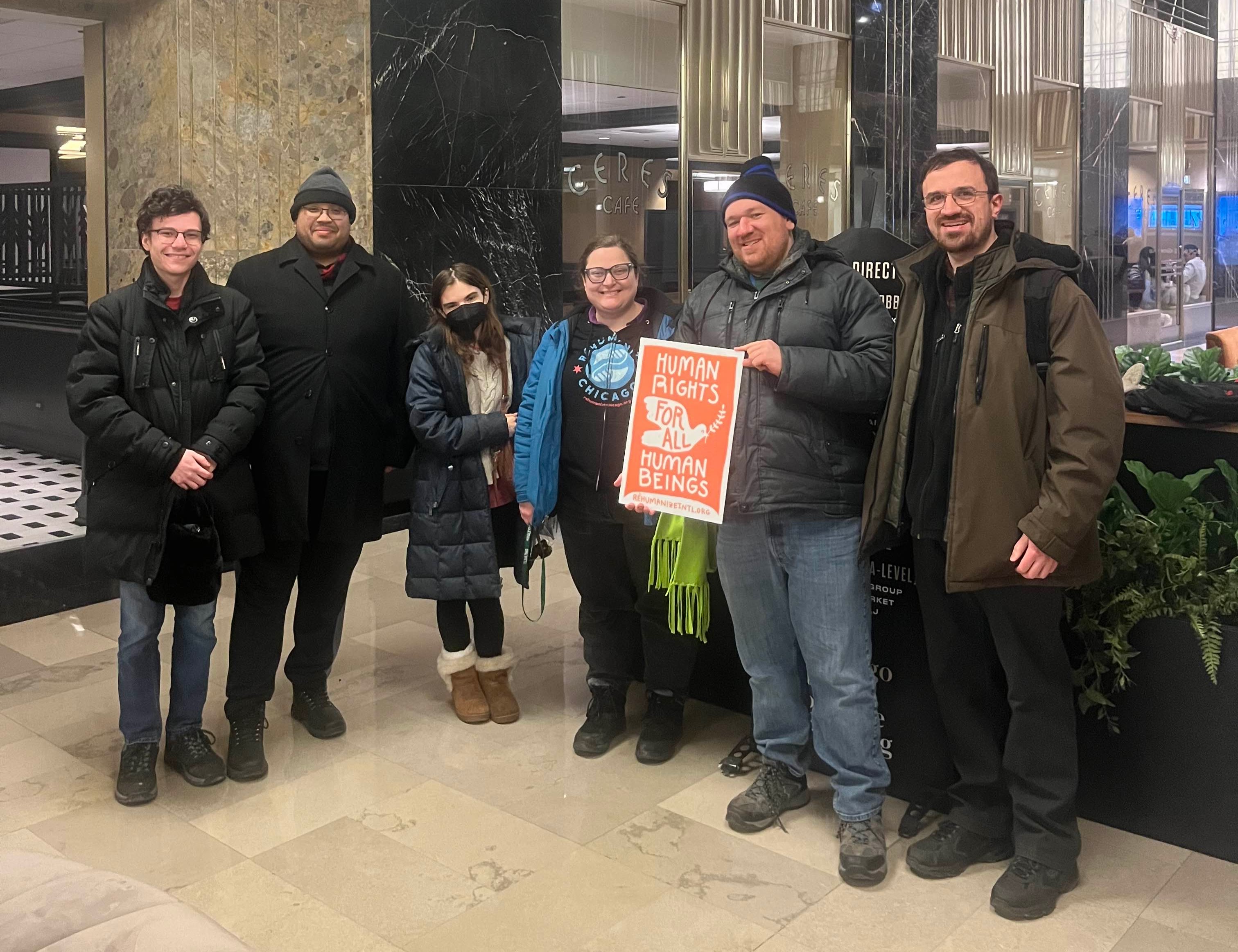 group photo inside after Rehumanize Chicago's Day of Horror and Hope march